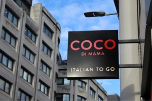 Coco di Mama projecting sign on a building exterior