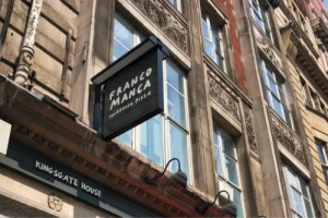Projecting sign outside a building on a narrow street